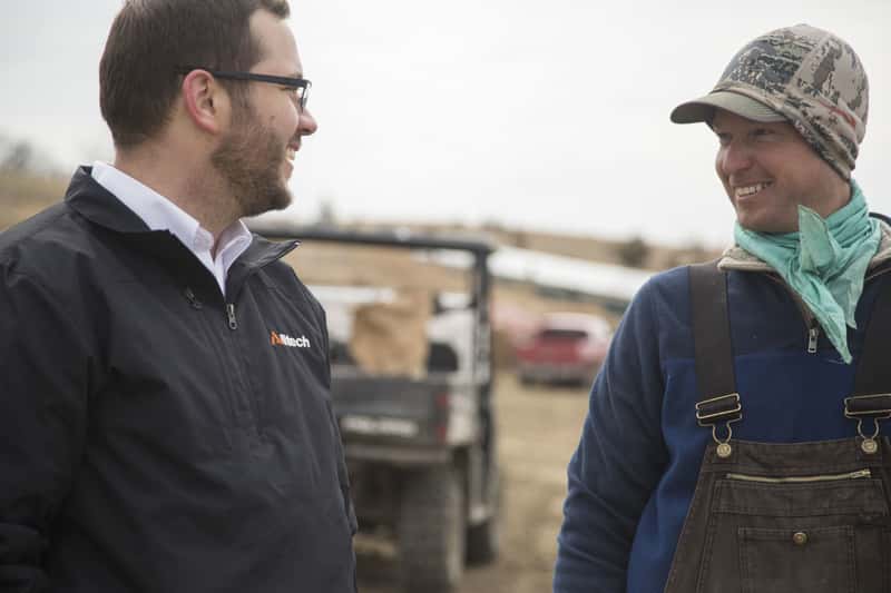 Alltech Employee on-farm with farmer