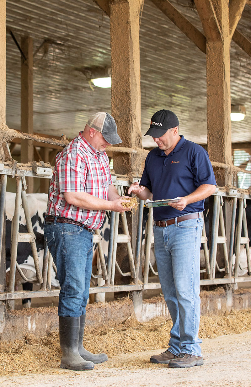 Alltech Employee on-farm with farmer
